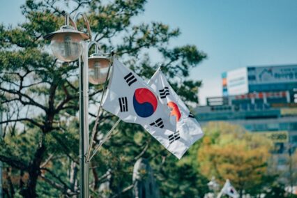 Two South Korean flags waving in a park in South Korea